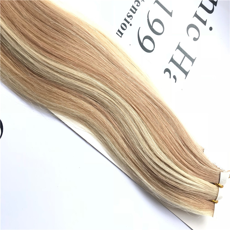 Tape hair extension installation process requires no heat, no beads, and no tools J05